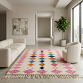 Ivory Azilal rug with all-over pink diamond pattern in a sunlit modern living room