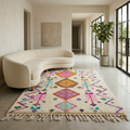 Ivory Azilal rug with multicolor diamonds and zigzags in a sunlit modern living room