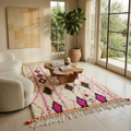 Pink diamond lattice Azilal Berber rug in a warm living room with boucle chair and wood table
