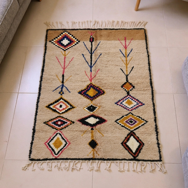 Azilal wheat wool rug with mustard, red and purple Amazigh diamonds and tree motifs, shown flat