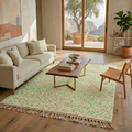 Ivory speckled Beni Ourain rug in a bright living room with neutral sofa and wood table