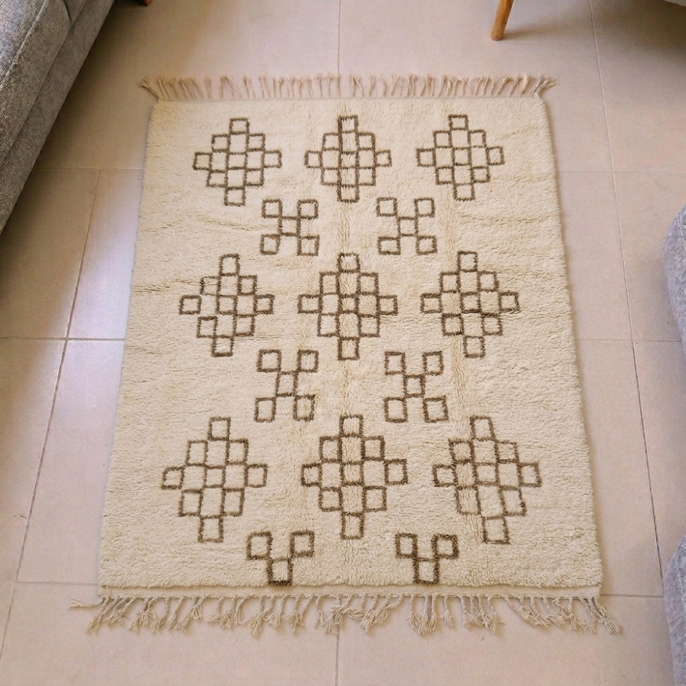 Beni Ourain ivory wool rug with brown checkerboard diamond grid motifs, shown flat