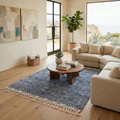 Charcoal melange Beni Ourain rug in a modern living room with neutral sofa