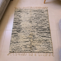 Beni Ourain ivory and black broken stripe wool rug, shown flat