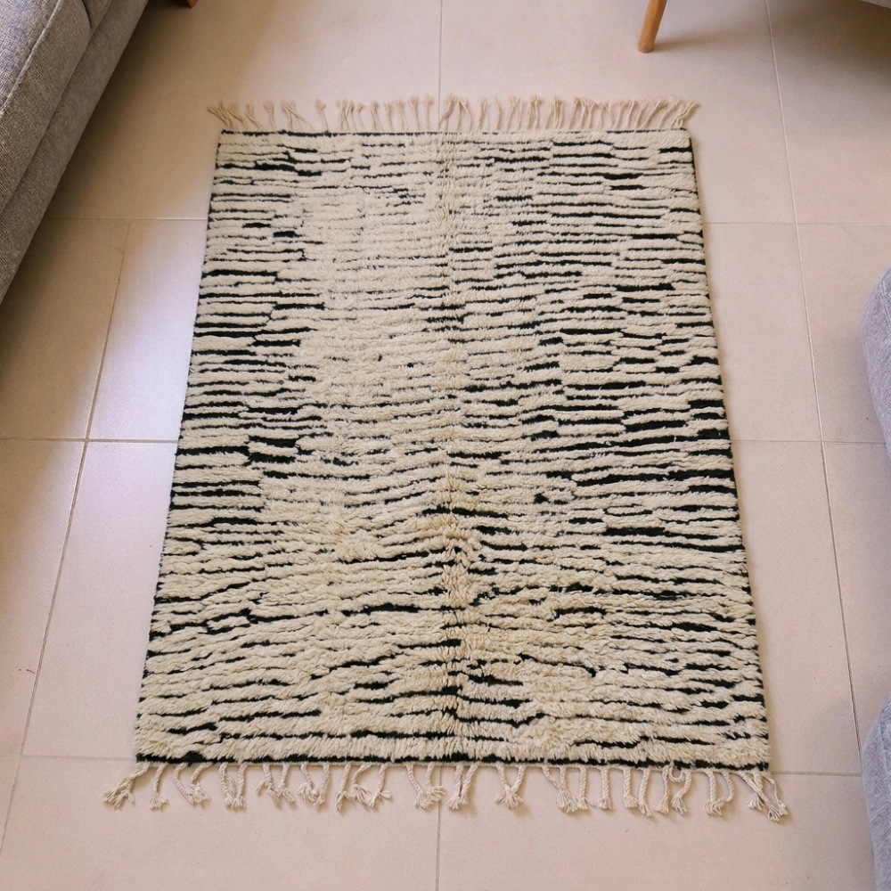 Beni Ourain ivory and black broken stripe wool rug, shown flat