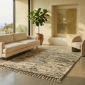 Graphic black and white Beni Ourain stripe rug in a bright contemporary room