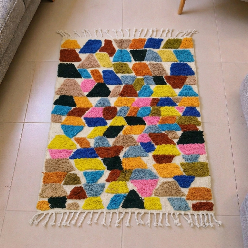 Beni Ourain multicolor mosaic wool rug with pink, blue and yellow polygons, shown flat