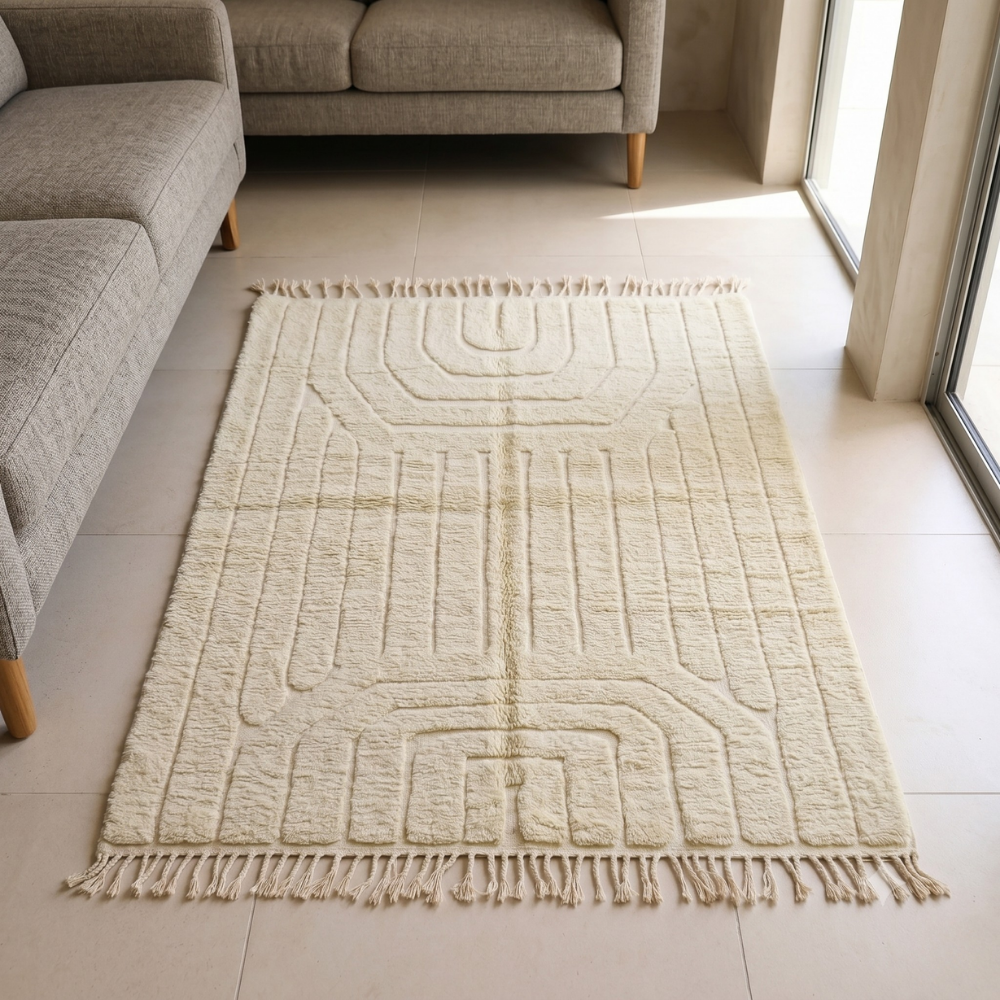 Tone-on-tone ivory Beni Ourain rug with carved relief in a serene bedroom