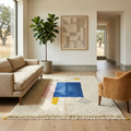 Ivory Beni Ourain rug with blue and pink blocks in a bright contemporary room