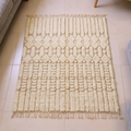 Beni Ourain ivory textured tribal wool rug, shown flat
