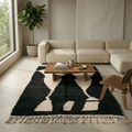 Bold black and ivory abstract Beni Ourain rug in a modern living room