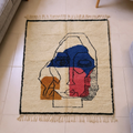 Beni Ourain ivory abstract face wool rug with blue, pink and orange, shown flat