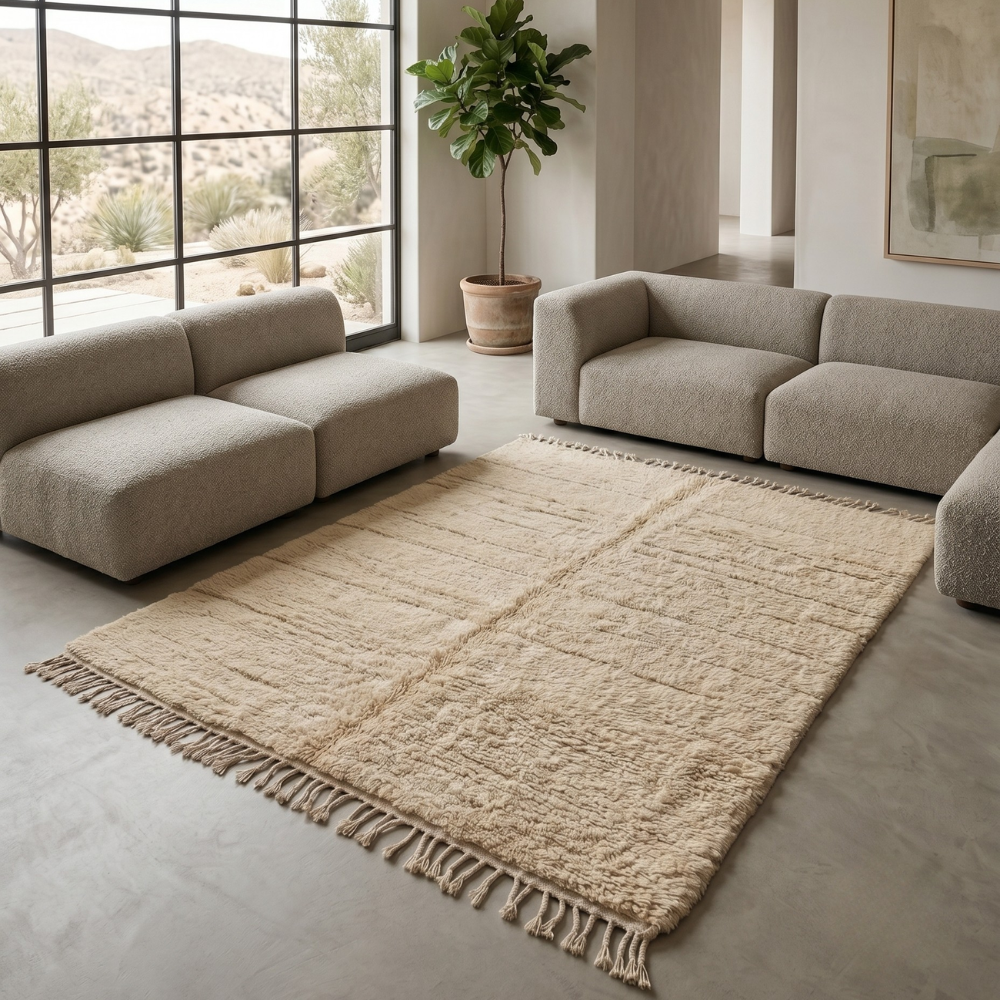 Ivory Mrirt high-pile wool rug styled in a neutral living room with grey sofas