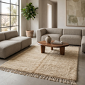 Plush ivory Moroccan Mrirt rug under a wooden coffee table in a bright living room