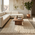 Ivory Mrirt high-pile wool rug styled in a warm neutral living room with cream sofa