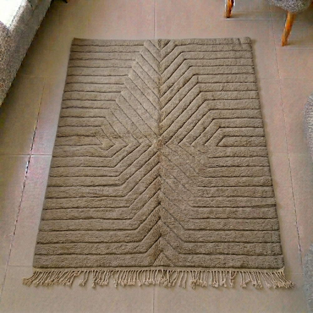 Mrirt taupe and grey-brown wool rug with carved radiating chevron ridges, shown flat