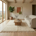Ivory carved-panel Mrirt high-pile rug styled in a bright neutral living room