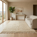 Textured ivory Moroccan Mrirt rug in a sunlit minimalist interior