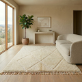 Plush ivory Moroccan Mrirt Beni Ourain rug in a sunlit interior