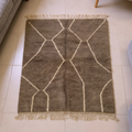 Mrirt brown plush wool rug with organic ivory line lattice, shown flat