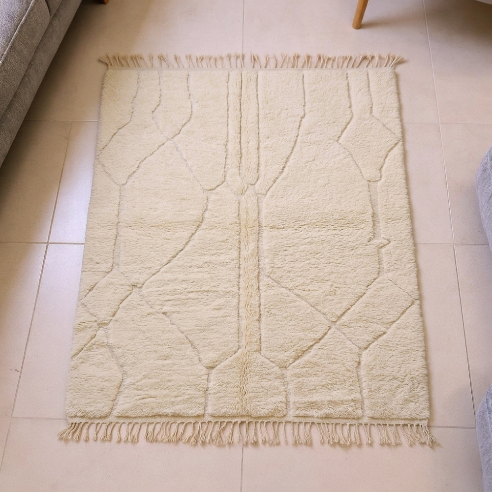 Mrirt ivory plush wool rug with bold black linear maze geometry, shown flat