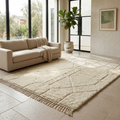 Modern ivory Moroccan Mrirt maze rug in a sunlit interior