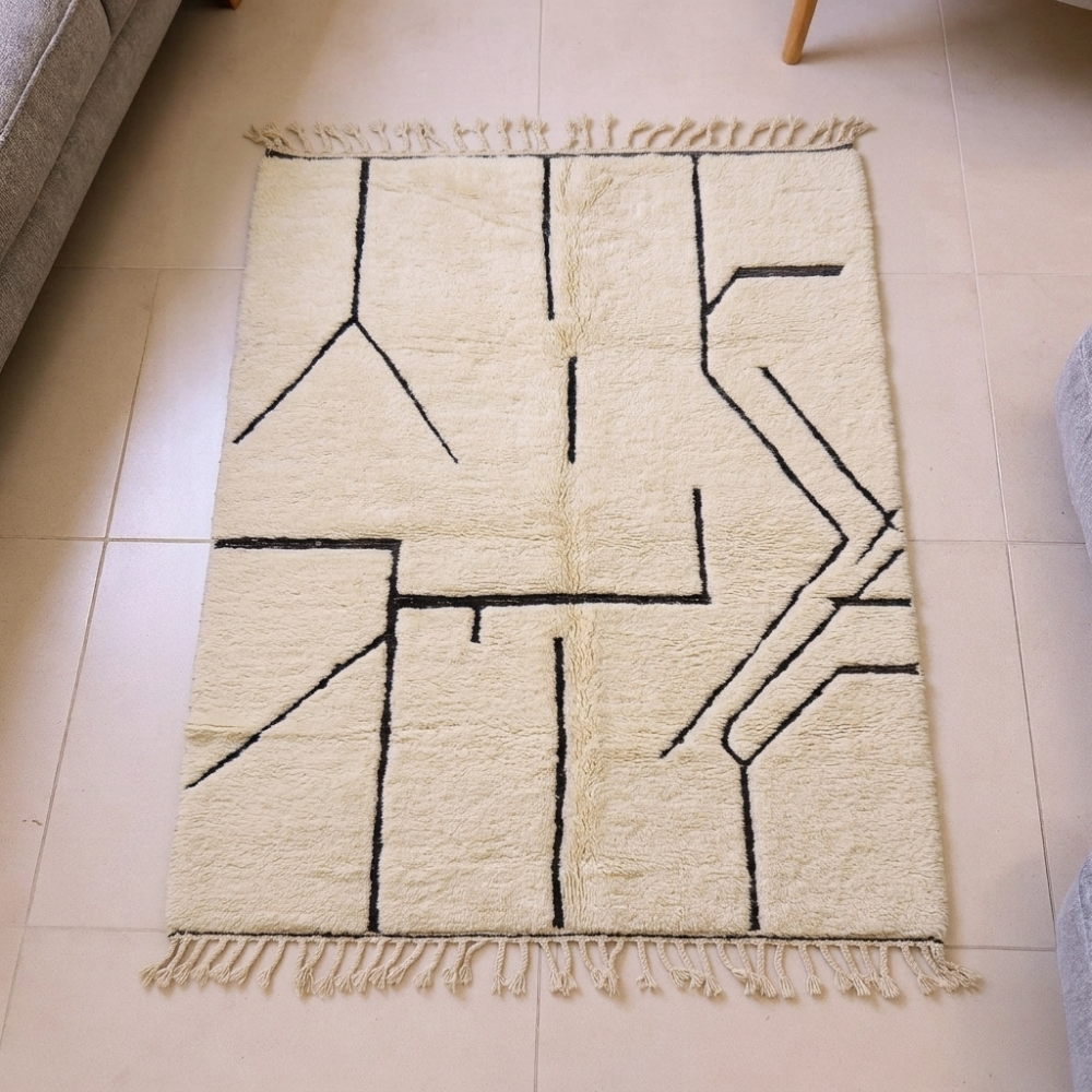 Mrirt plush ivory Berber shag wool rug with fringe tassels, shown flat