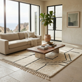 Pure ivory Mrirt shag rug styled in a bright neutral living room